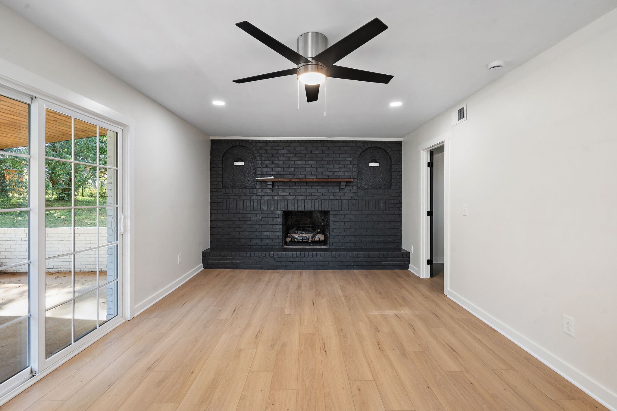1015 Lock 4 Road Gallatin, TN 37066 - Photo 12 of 47 a view of empty room with wooden floor and fan