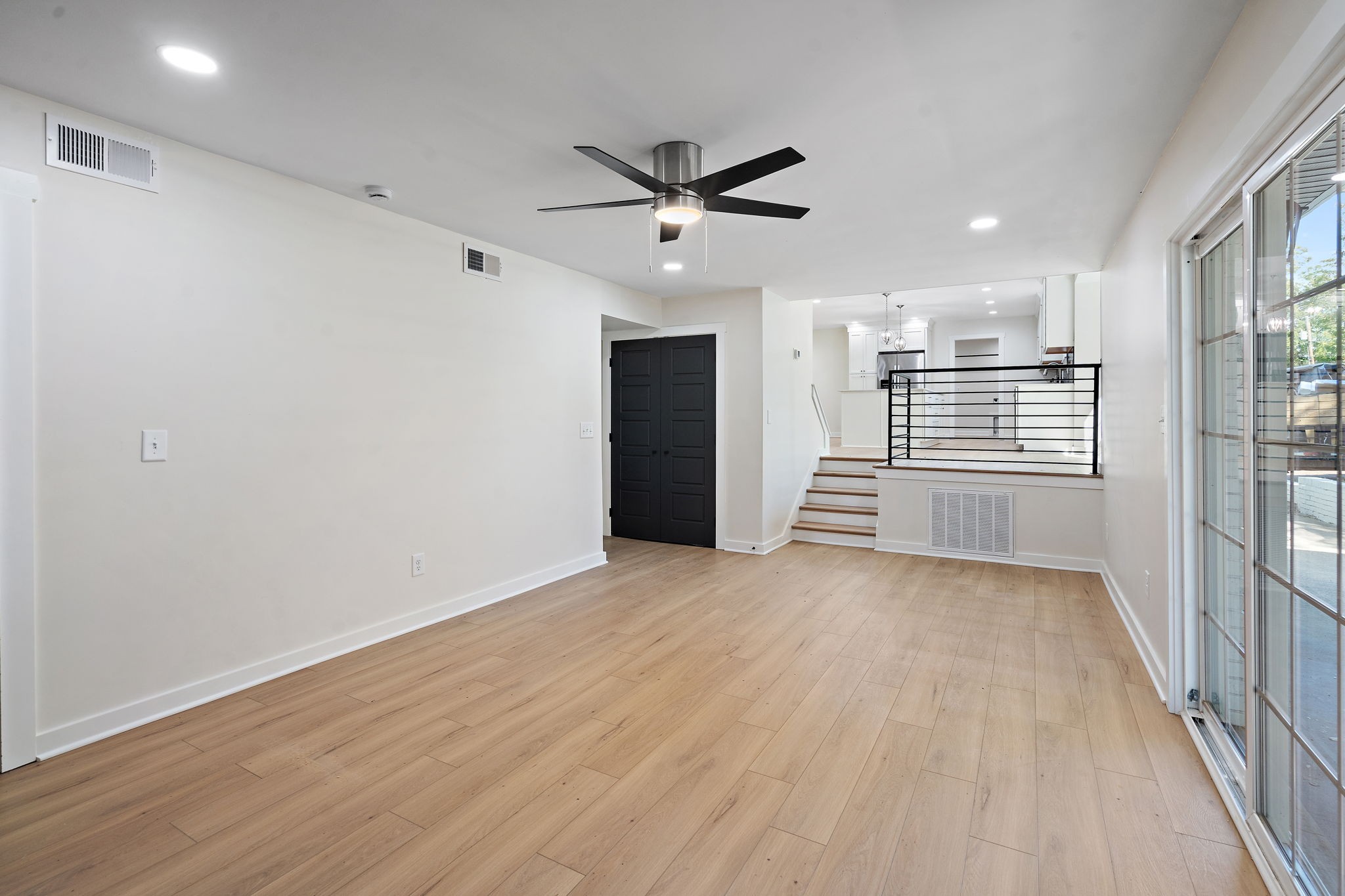 1015 Lock 4 Road Gallatin, TN 37066 - Photo 15 of 47 a view of a livingroom with a ceiling fan & hardwood floor