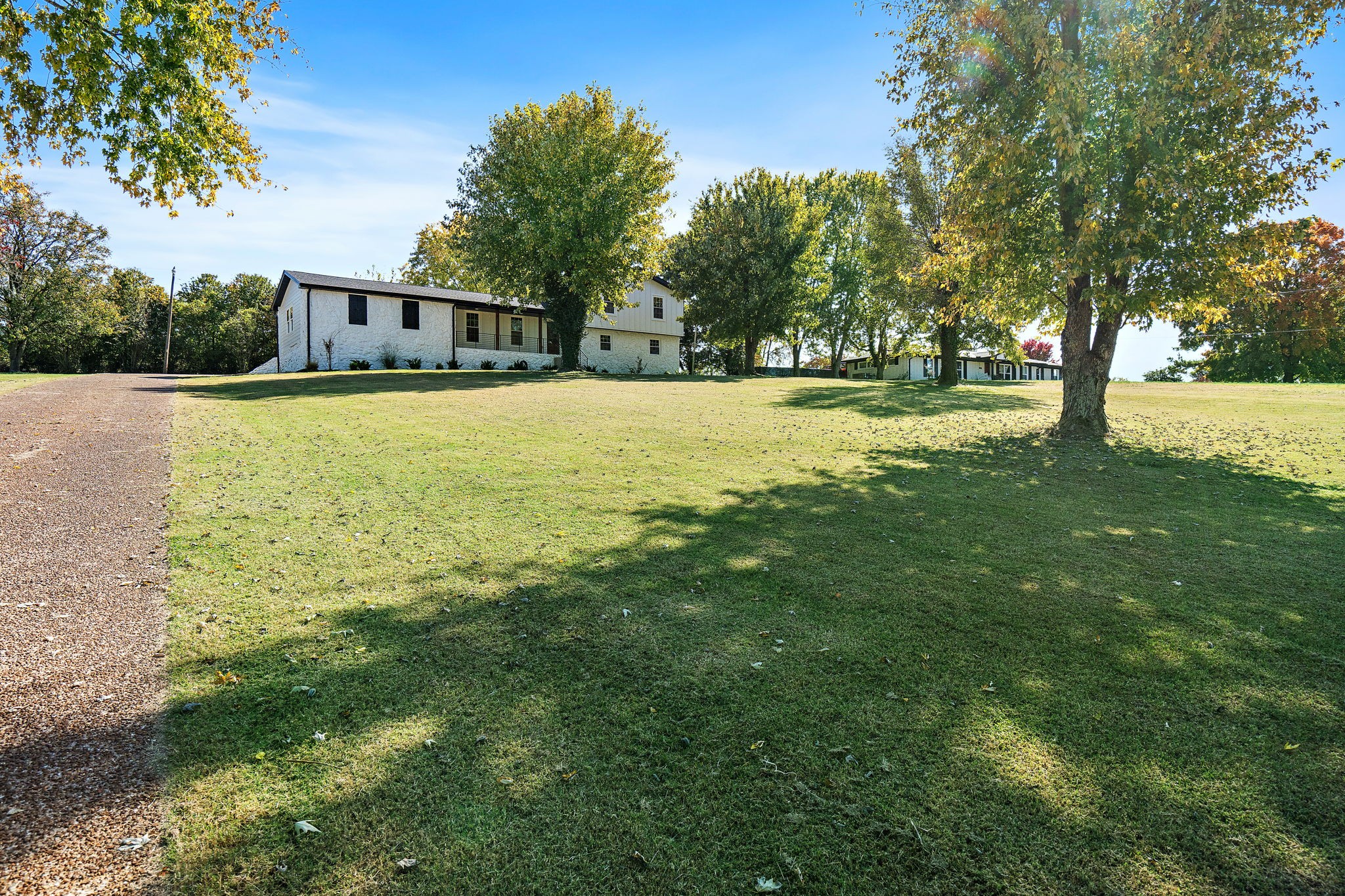 1015 Lock 4 Road Gallatin, TN 37066 - Photo 2 of 47 a view of house with trees in the background