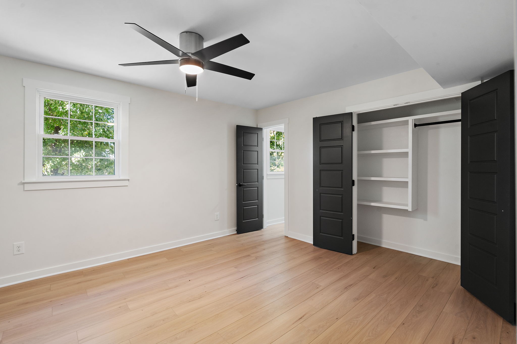 1015 Lock 4 Road Gallatin, TN 37066 - Photo 21 of 47 a view of a room with a ceiling fan and a window