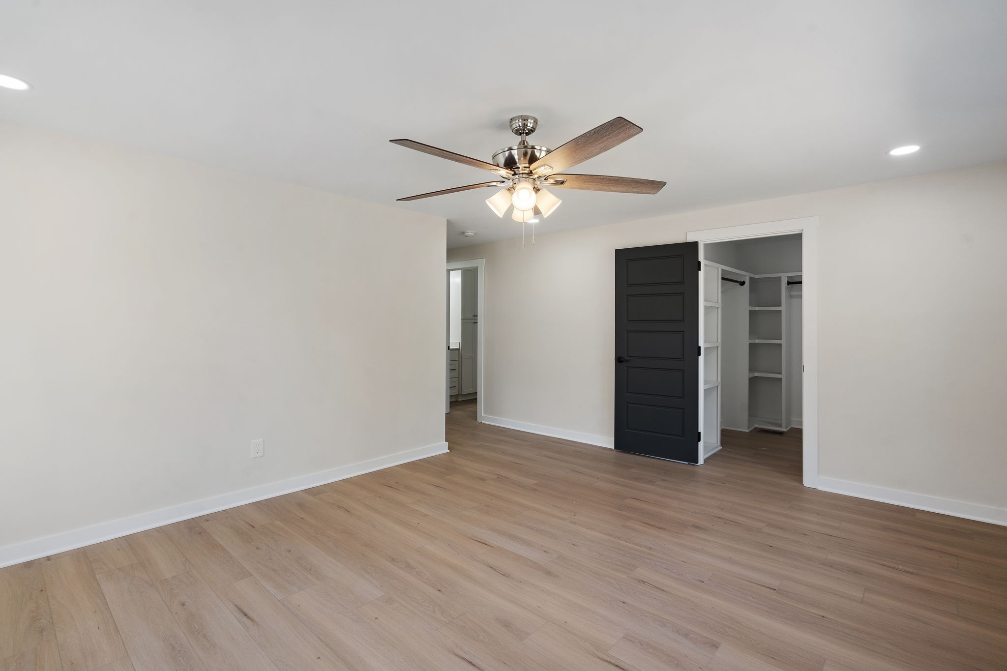 1015 Lock 4 Road Gallatin, TN 37066 - Photo 22 of 47 a view of an empty room with a ceiling fan