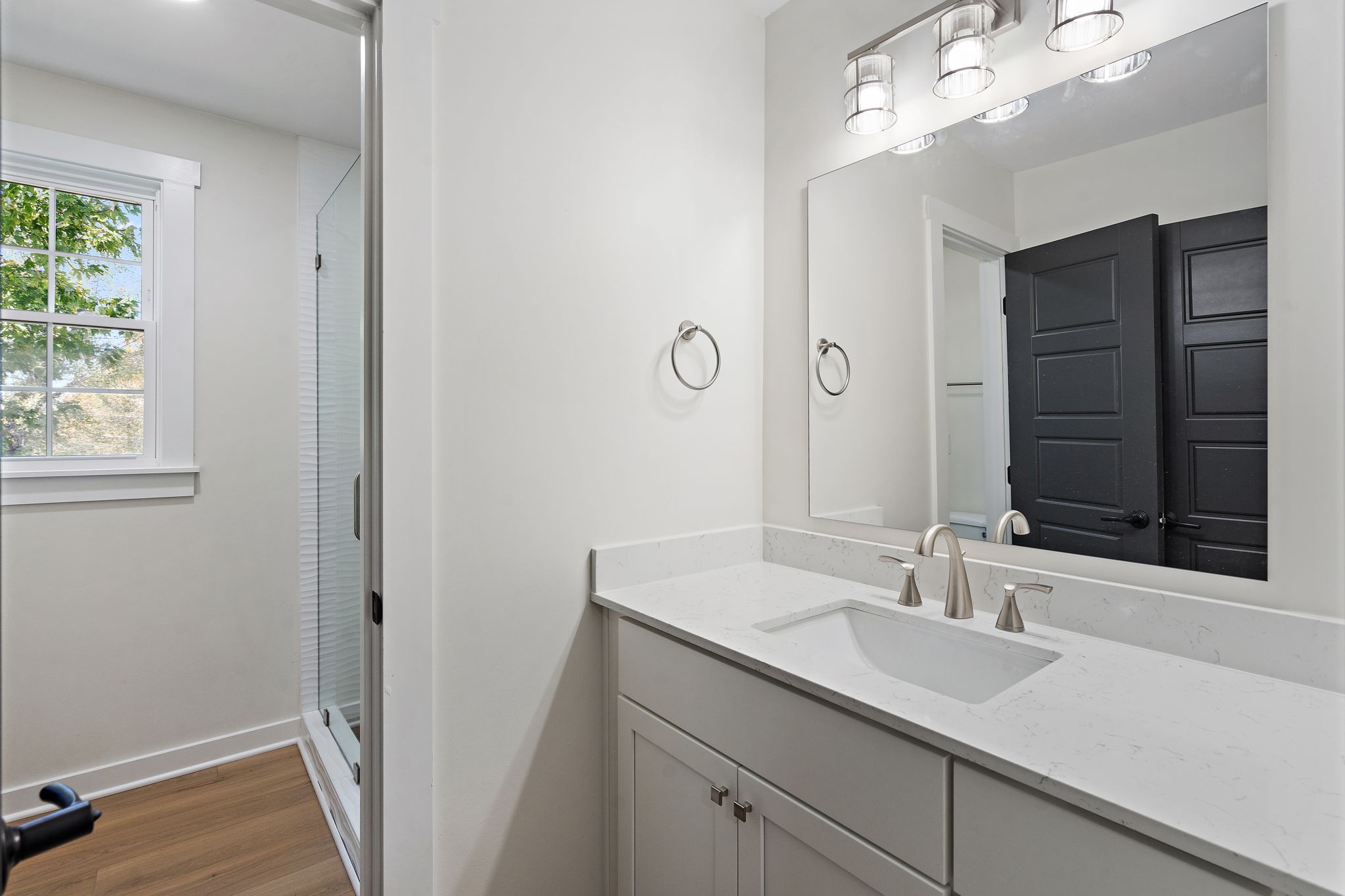 1015 Lock 4 Road Gallatin, TN 37066 - Photo 23 of 47 a bathroom with a sink and a mirror