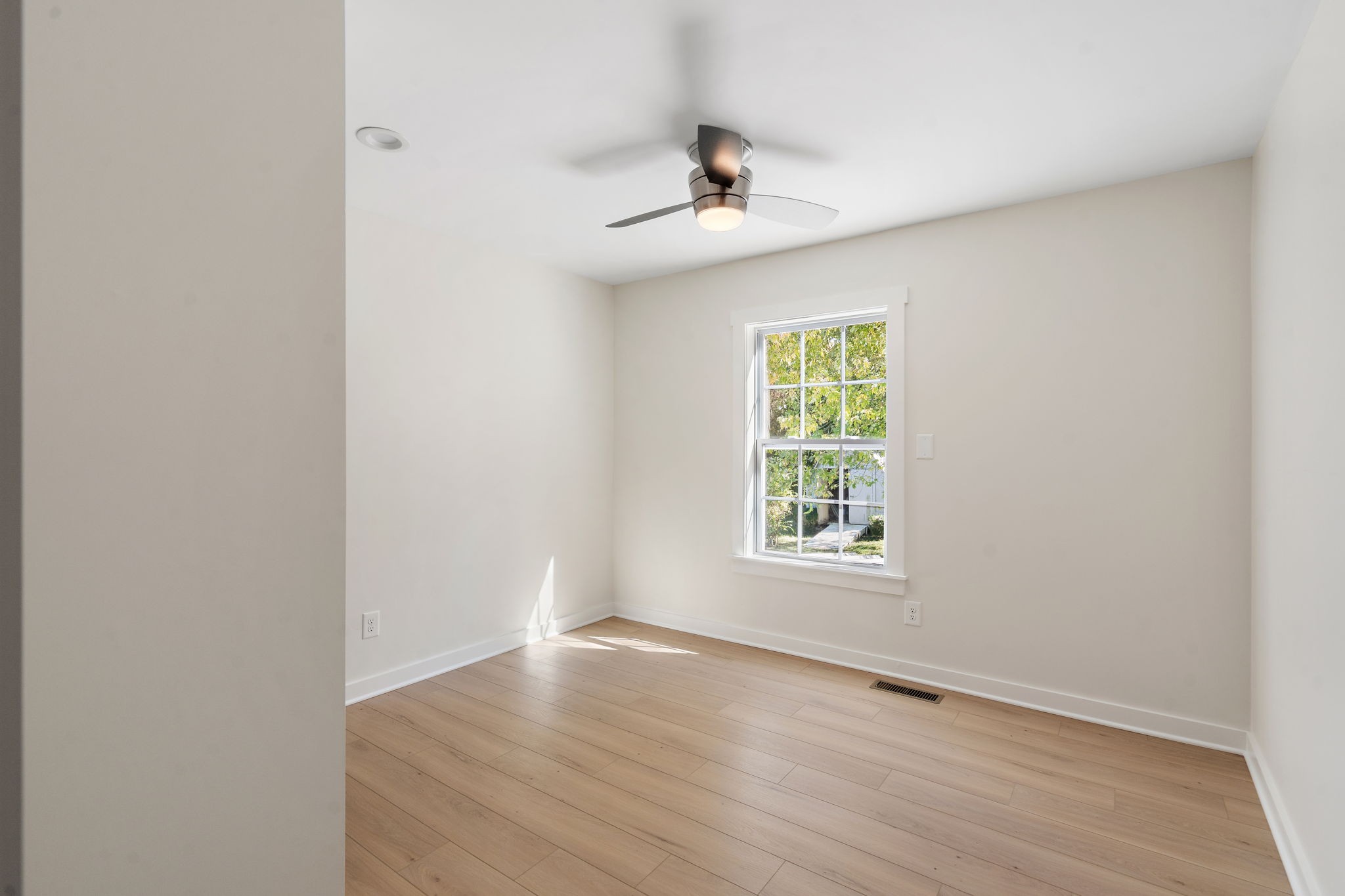 1015 Lock 4 Road Gallatin, TN 37066 - Photo 25 of 47 wooden floor in an empty room with a window