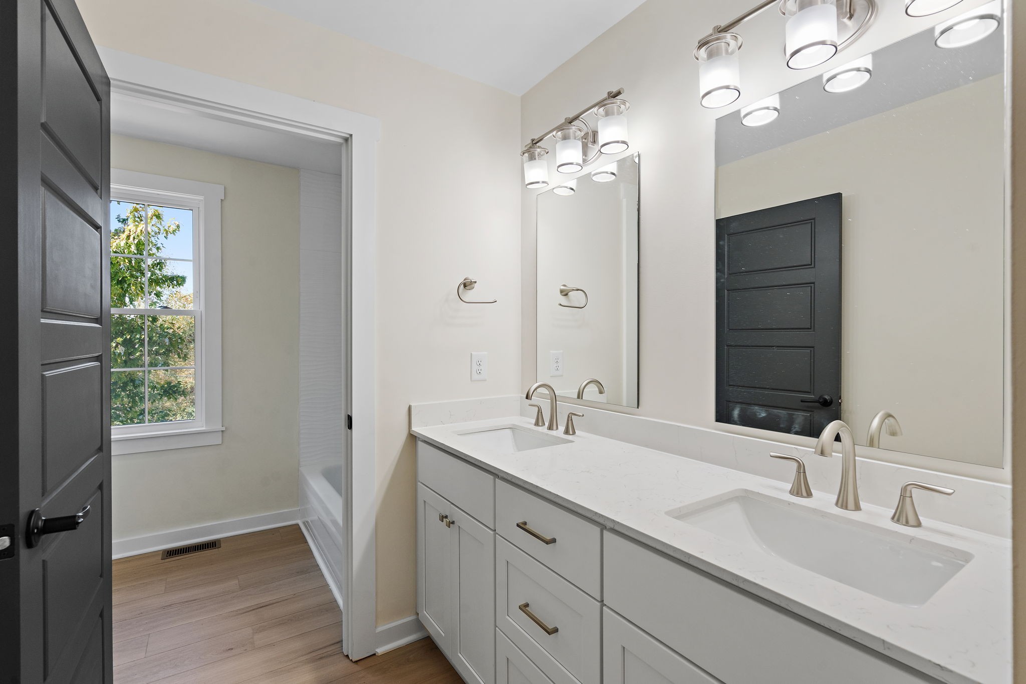 1015 Lock 4 Road Gallatin, TN 37066 - Photo 32 of 47 a bathroom with a double vanity sink and a mirror
