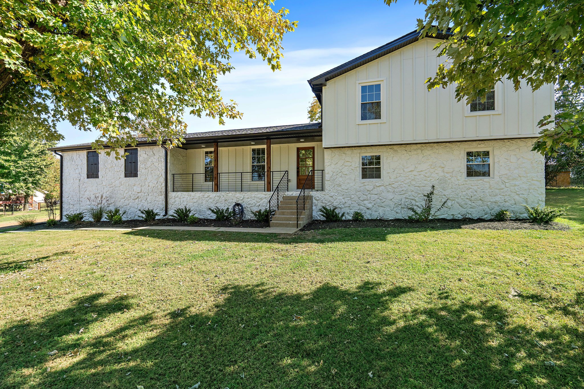 1015 Lock 4 Road Gallatin, TN 37066 - Photo 41 of 47 a front view of house with yard and trees around