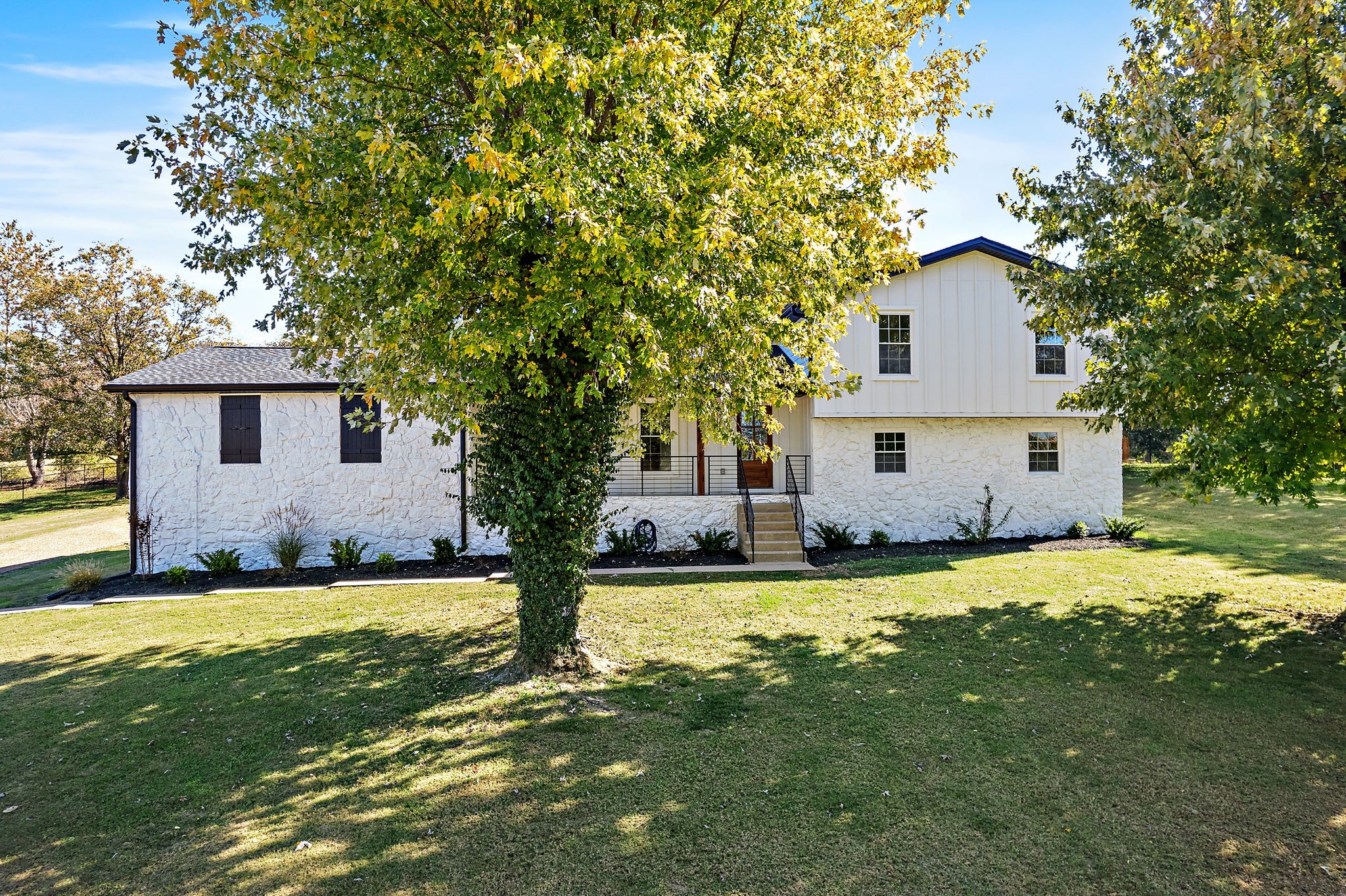 1015 Lock 4 Road Gallatin, TN 37066 - Photo 42 of 47 a front view of house with yard and trees
