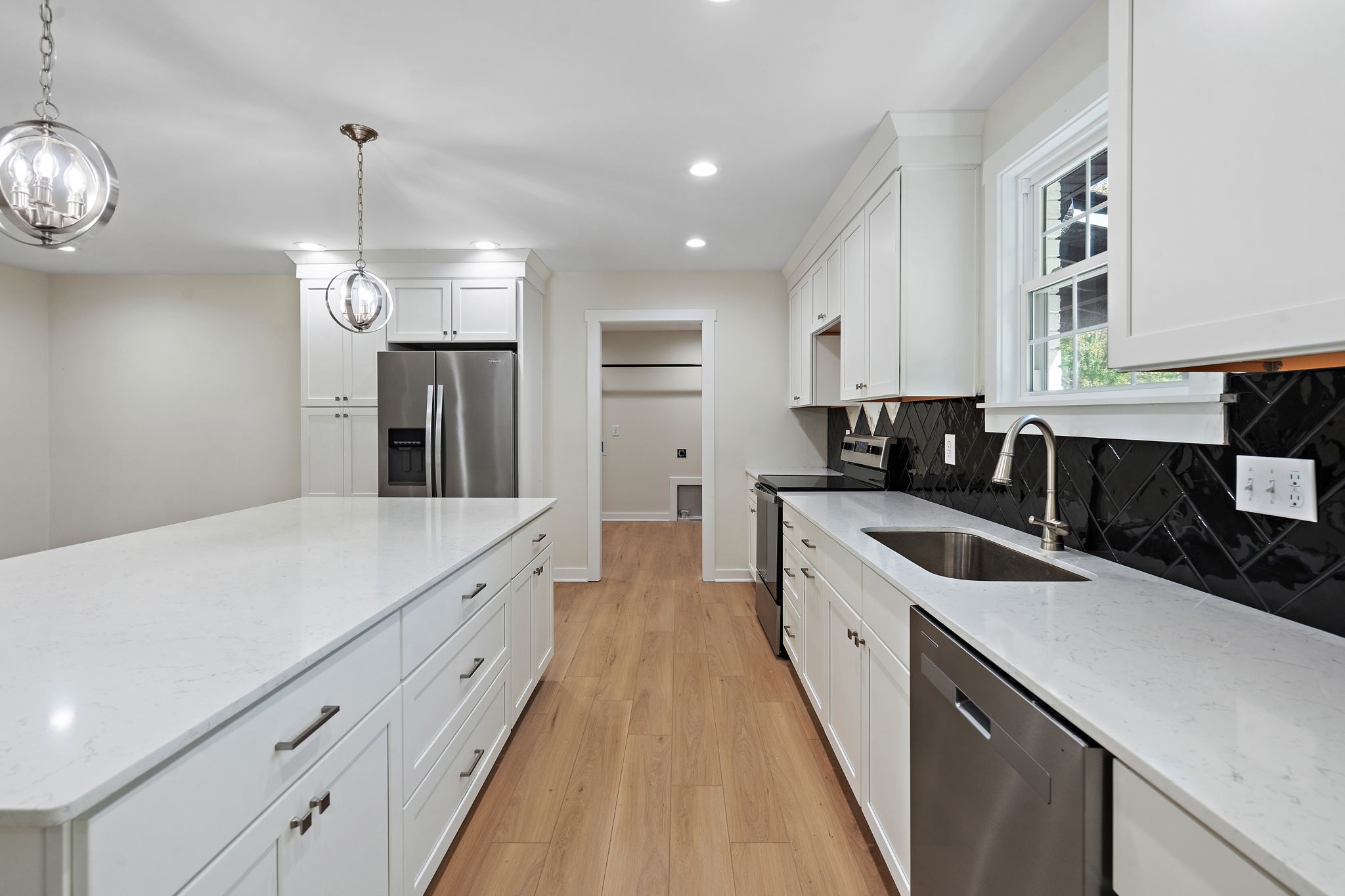1015 Lock 4 Road Gallatin, TN 37066 - Photo 8 of 47 a large kitchen with a stove and a sink