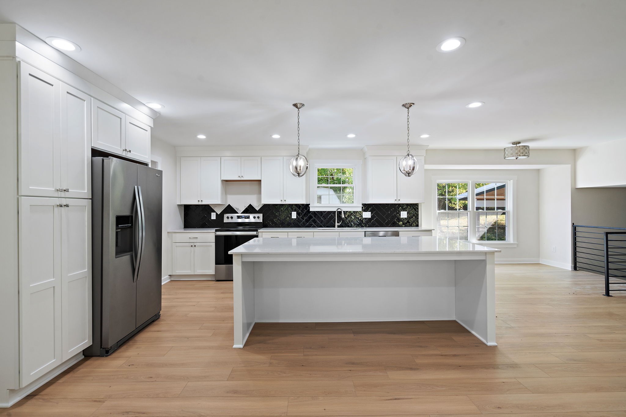 1015 Lock 4 Road Gallatin, TN 37066 - Photo 9 of 47 a view of kitchen with refrigerator microwave and stove