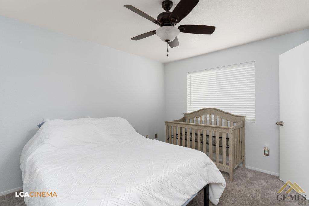 Undisclosed Address Bakersfield, CA 93307 - Photo 11 of 18 a bedroom with a bed and a window
