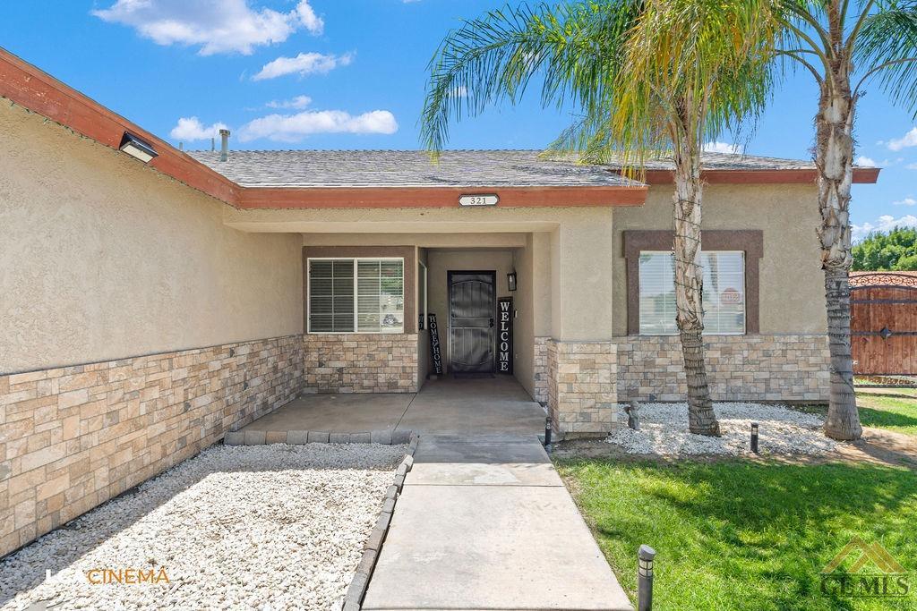 Undisclosed Address Bakersfield, CA 93307 - Photo 5 of 18 a view of a backyard with a palm tree