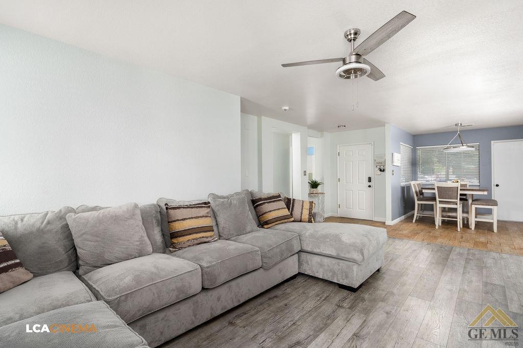 Undisclosed Address Bakersfield, CA 93307 - Photo 6 of 18 a living room with furniture and wooden floor