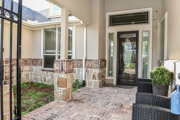 a front view of a house with a porch