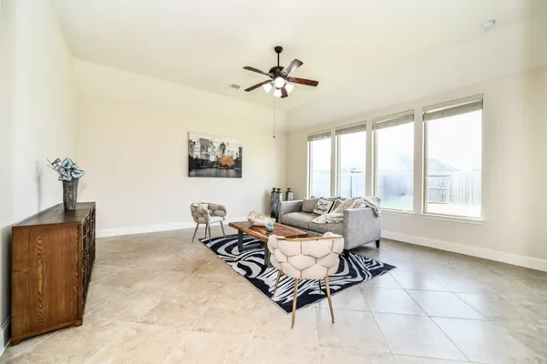 a living room with furniture and a window