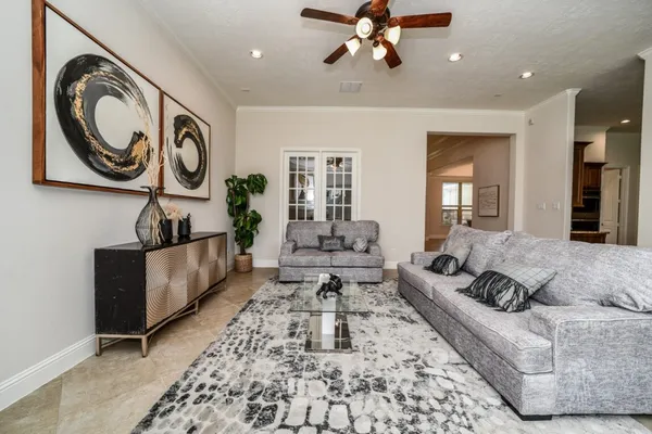 a living room with furniture and a large window