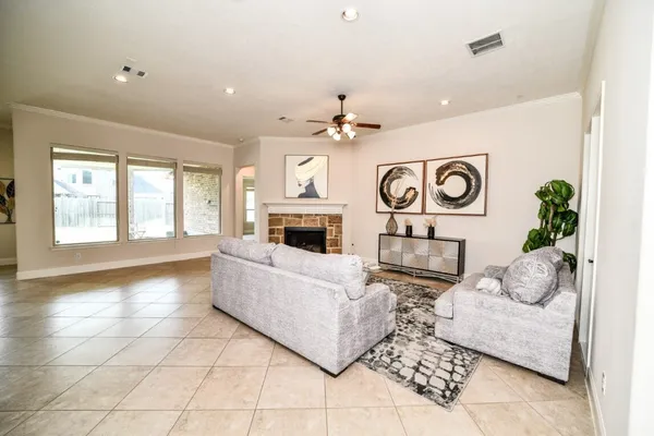 a living room with furniture and a fireplace