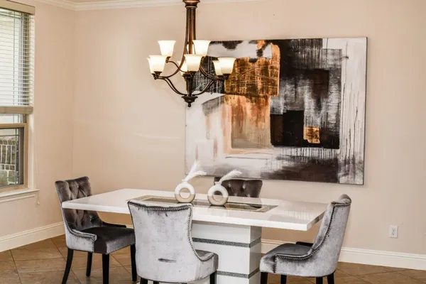 a table with a sink and wooden floor