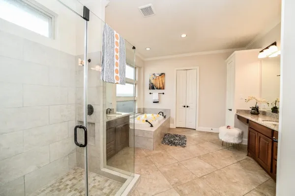 a spacious bathroom with a granite countertop sink and a mirror