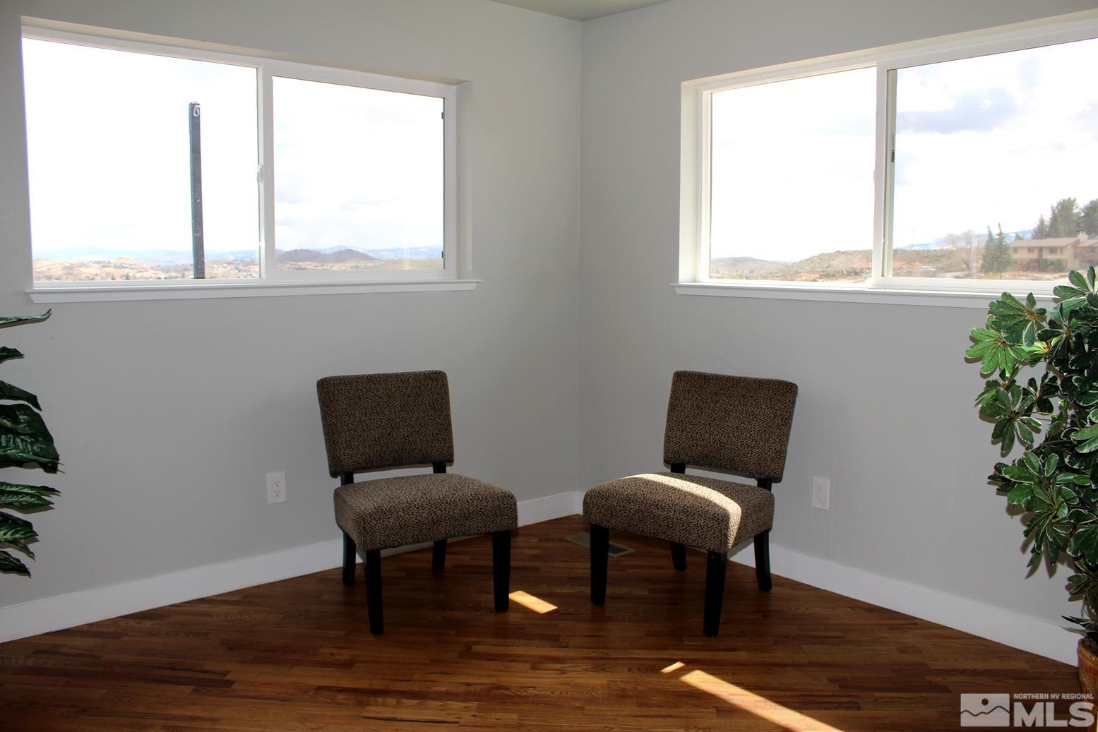 7775 Tamra Drive Reno, NV 89506 - Photo 13 of 40 a view of a room with chairs and wooden floor