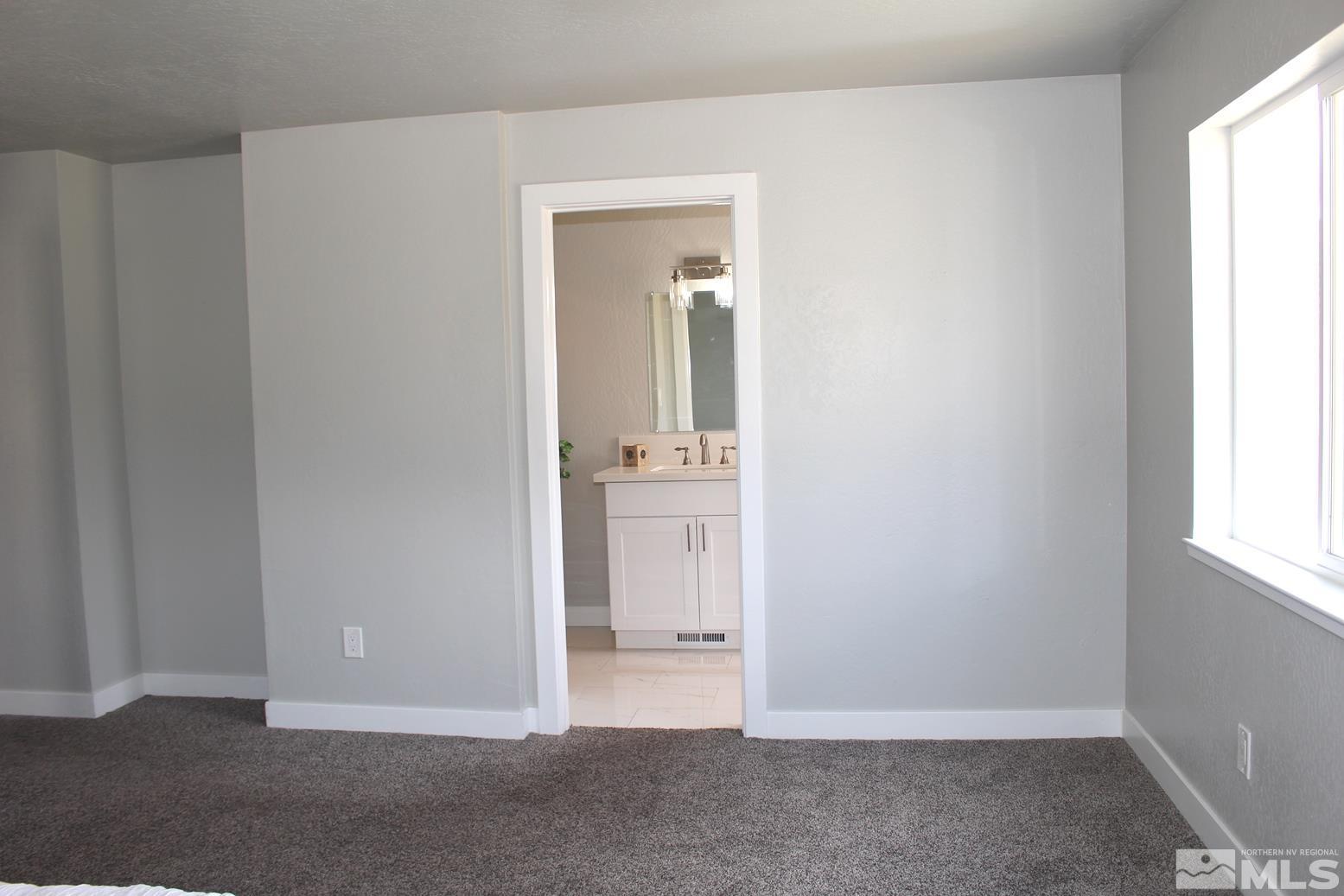 7775 Tamra Drive Reno, NV 89506 - Photo 16 of 40 an empty room with windows and closet