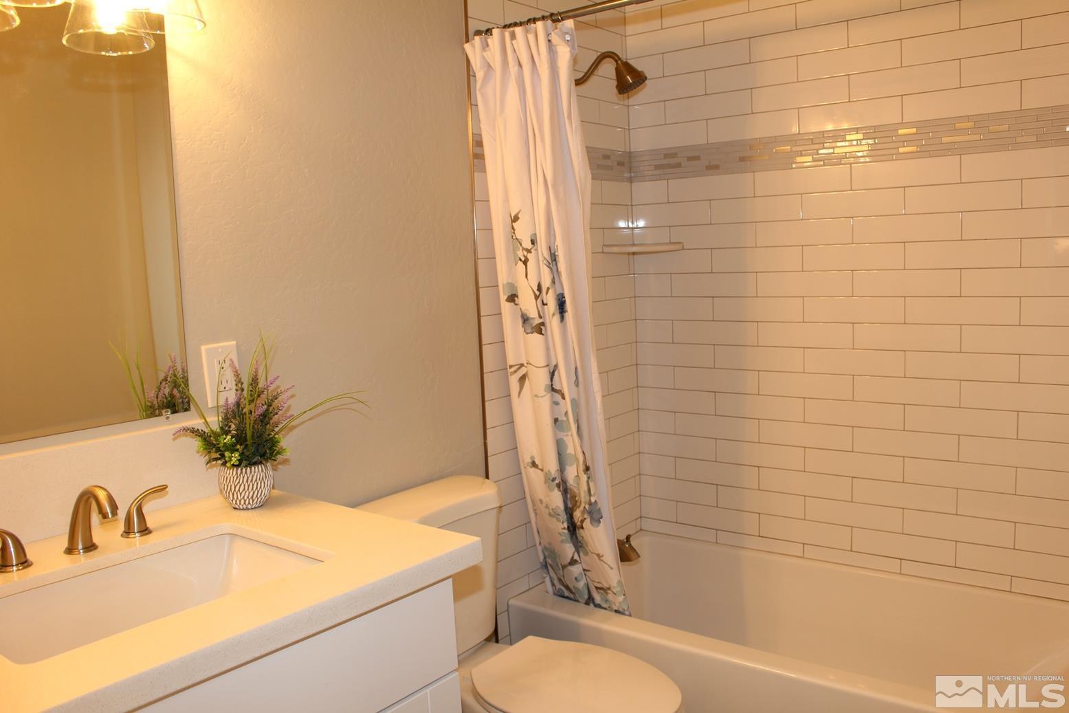 7775 Tamra Drive Reno, NV 89506 - Photo 21 of 40 a bathroom with a sink toilet and shower