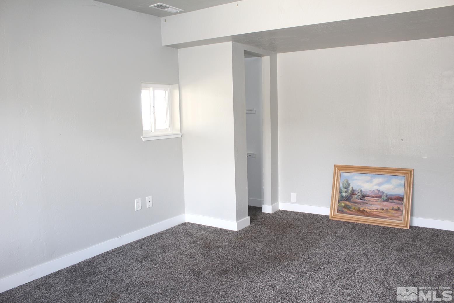 7775 Tamra Drive Reno, NV 89506 - Photo 29 of 40 an empty room with windows and closet