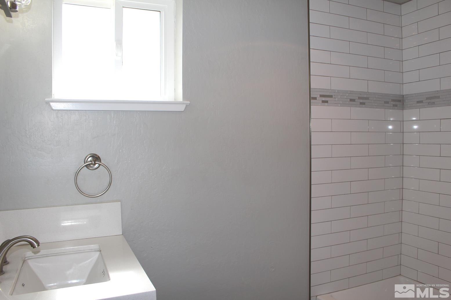 7775 Tamra Drive Reno, NV 89506 - Photo 35 of 40 a bathroom with a shower and a window
