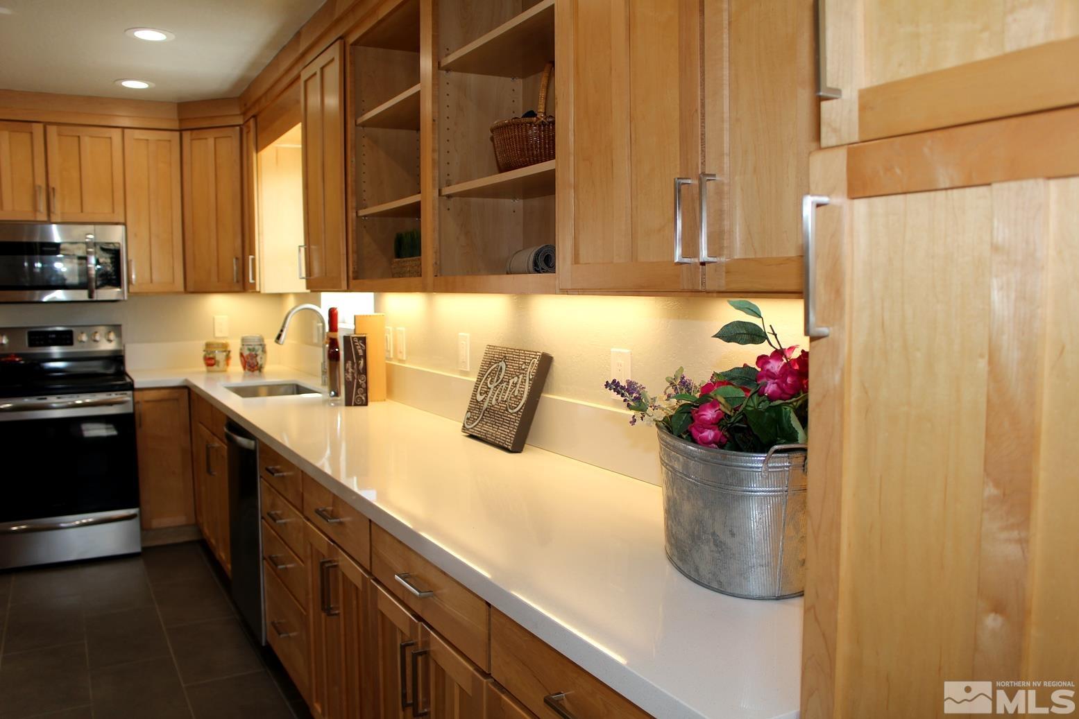 7775 Tamra Drive Reno, NV 89506 - Photo 6 of 40 a kitchen with a sink and cabinets