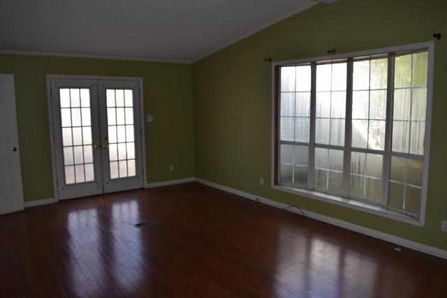 615 Adams Loop Tennessee Ridge, TN 37178 - Photo 13 of 18 a view of wooden floor and windows in a room