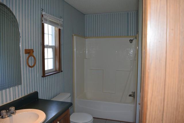 615 Adams Loop Tennessee Ridge, TN 37178 - Photo 10 of 18 a bathroom with a sink toilet and shower