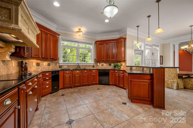 a kitchen with stainless steel appliances granite countertop wooden cabinets a stove a sink and a oven