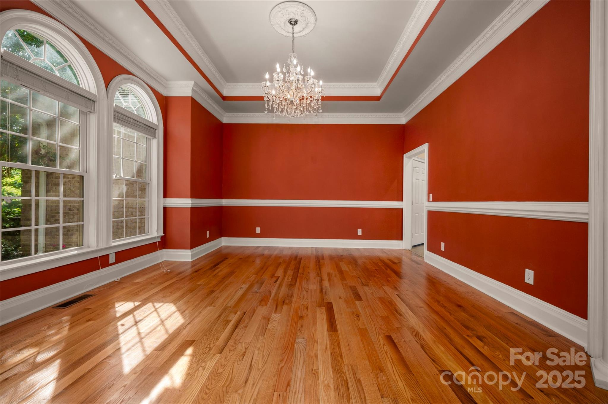 288 Palms Way Forest City, NC 28043 - Photo 16 of 47 a view of an empty room with wooden floor and a window
