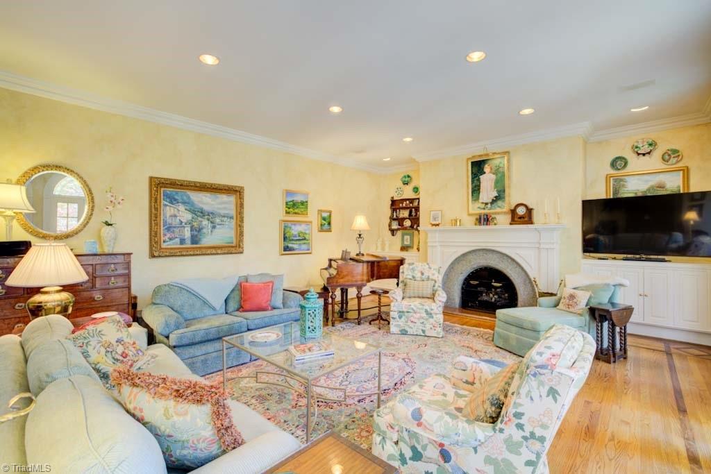 4464 Bent Tree Farm Road Winston-Salem, NC 27106 - Photo 20 of 50 Arched granite fireplace surround and hardwood floor detail