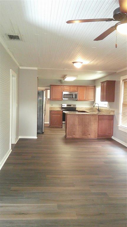 4609 Gallagher Road Plant City, FL 33565 - Photo 12 of 23 a view of kitchen and kitchen island
