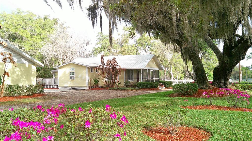 4609 Gallagher Road Plant City, FL 33565 - Photo 16 of 23 a front view of a house with yard and green space