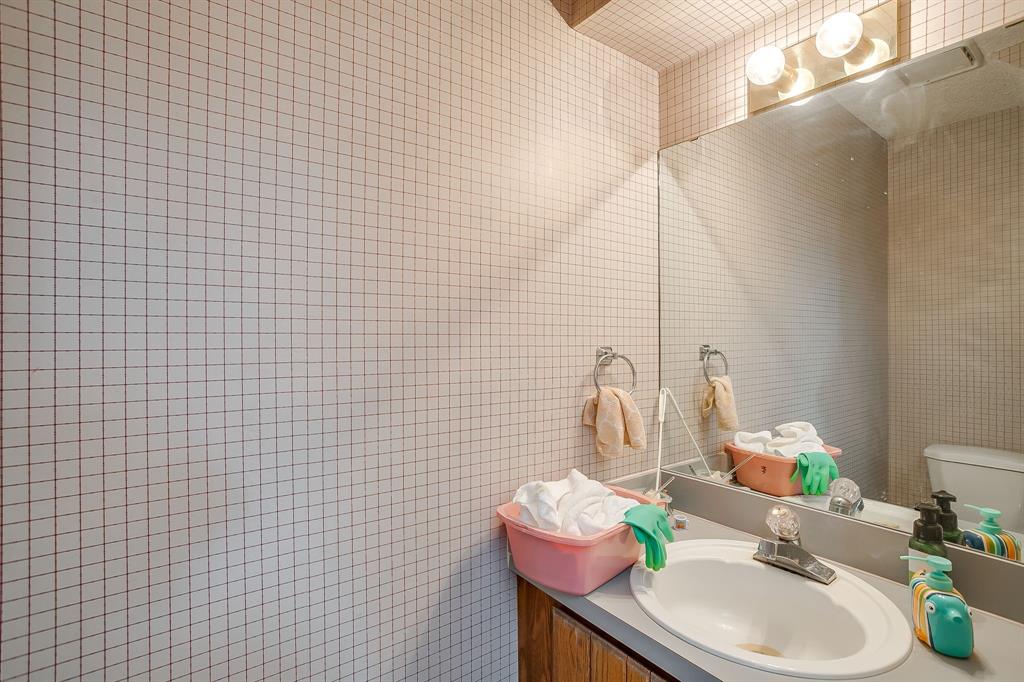 3133 Sappington Place, Unit D Fort Worth, TX 76116 - Photo 15 of 28 a bathroom with a sink a mirror and a shower