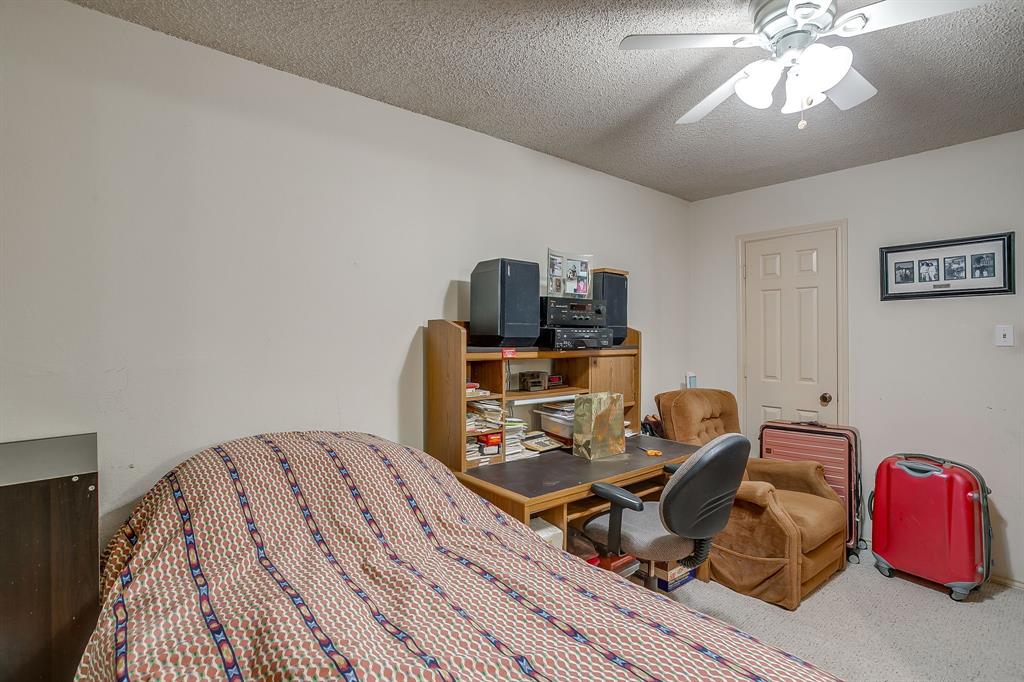3133 Sappington Place, Unit D Fort Worth, TX 76116 - Photo 18 of 28 a bed room with a bed and a fish tank
