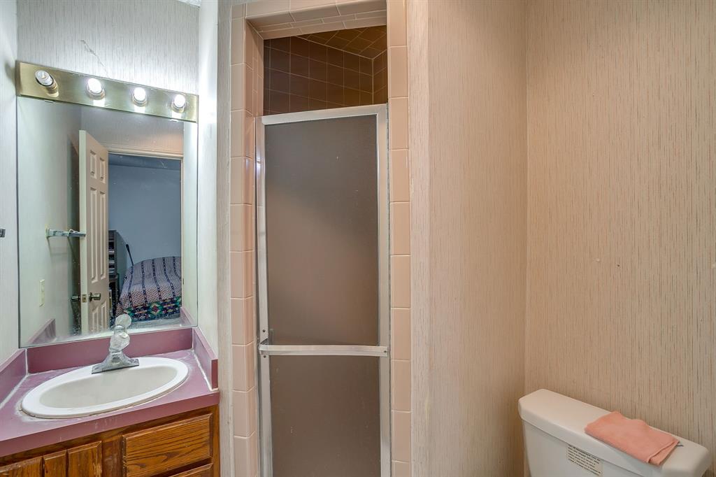 3133 Sappington Place, Unit D Fort Worth, TX 76116 - Photo 19 of 28 a bathroom with a sink and a mirror