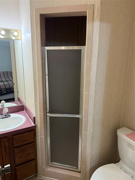 3133 Sappington Place, Unit D Fort Worth, TX 76116 - Photo 27 of 28 a bathroom with a toilet and a sink