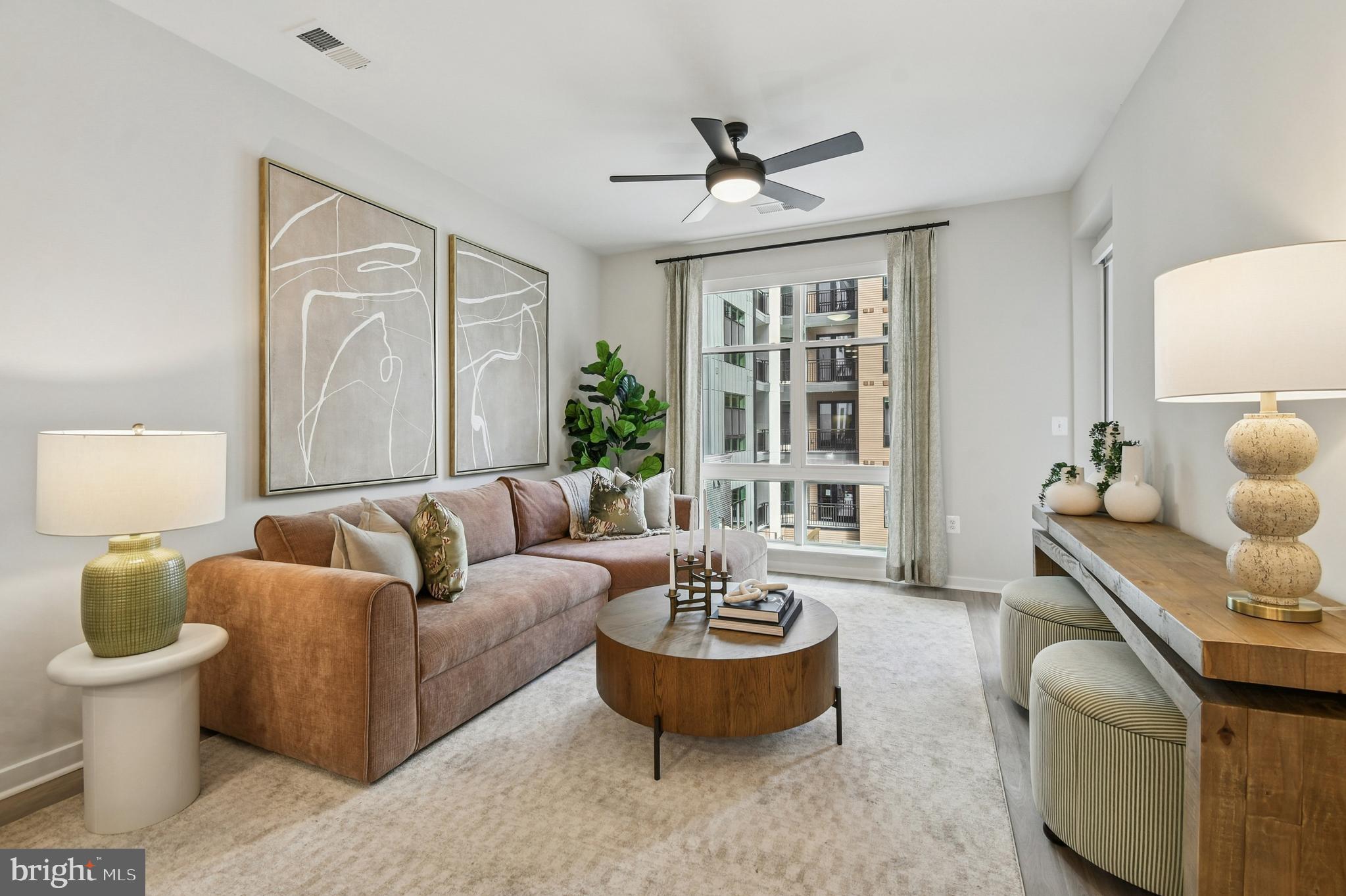 43601 Charitable Street, Unit 273 Ashburn, VA 20148 - Photo 6 of 12 a living room with furniture and a large window