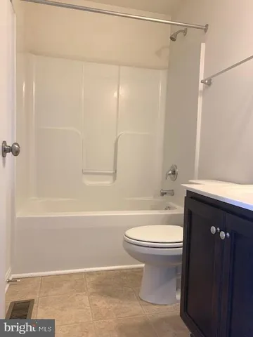 a bathroom with a sink a toilet and a bathtub