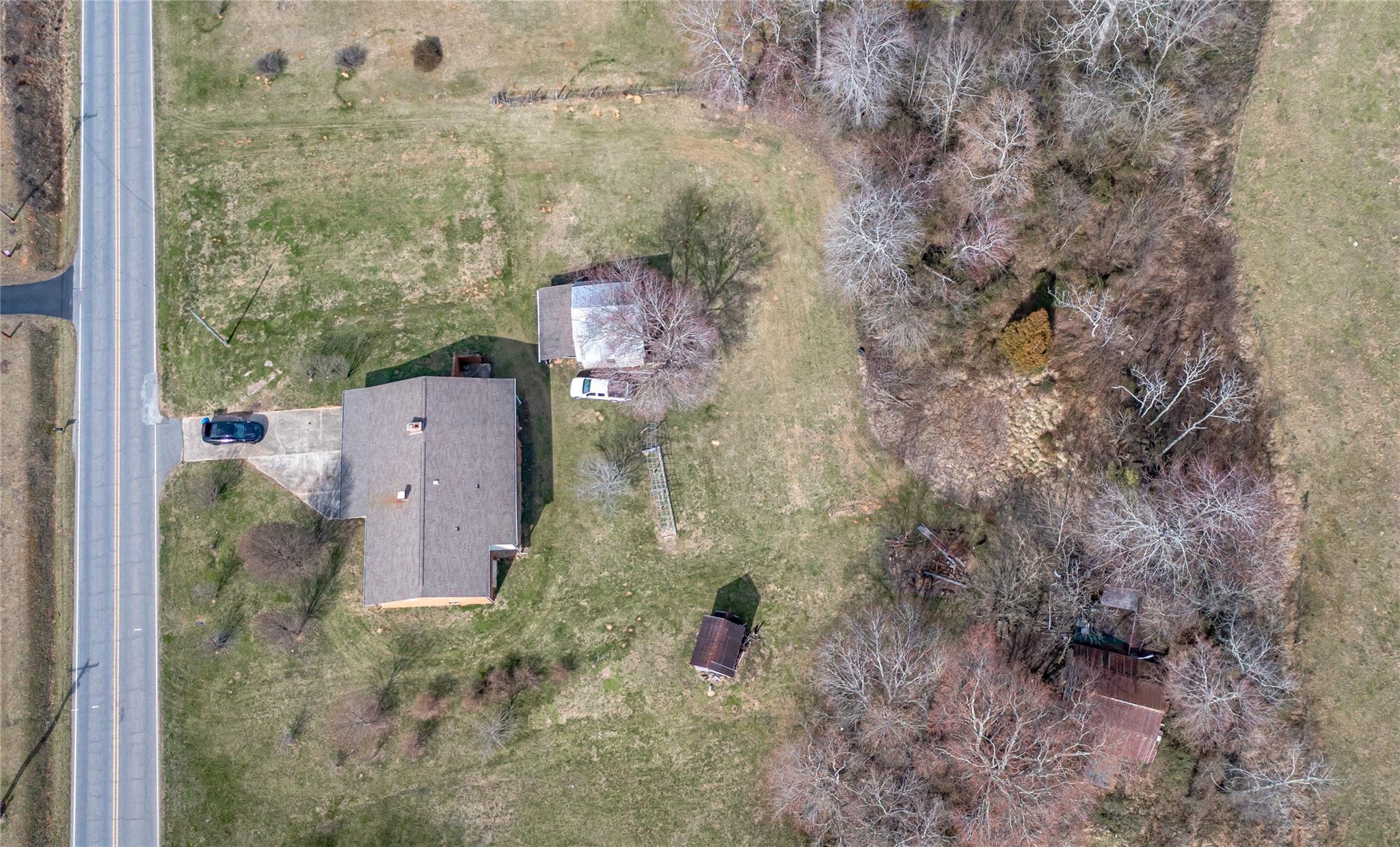 1437 Conley Road Morganton, NC 28655 - Photo 12 of 44 a aerial view of a house with lots of trees