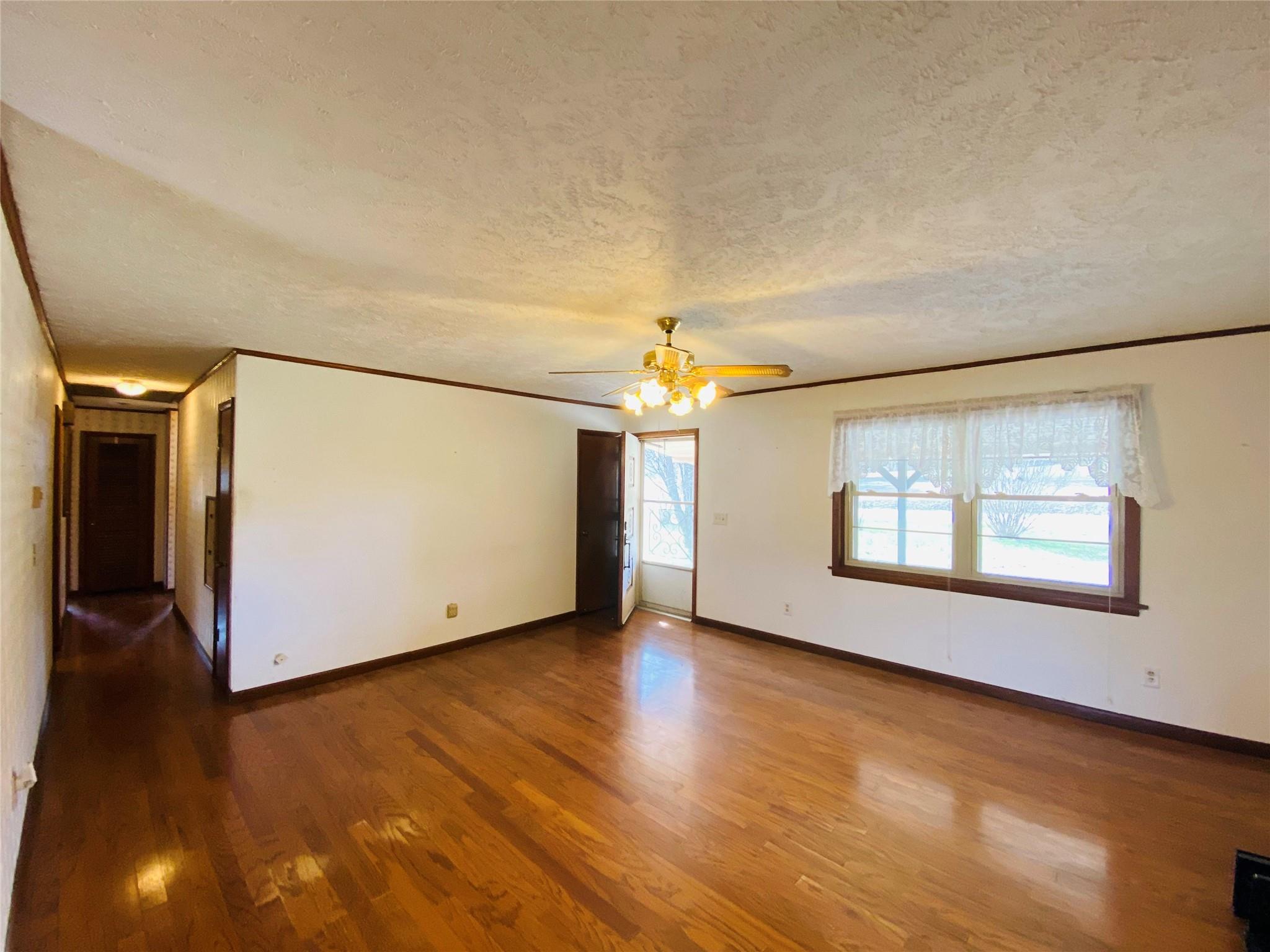 1437 Conley Road Morganton, NC 28655 - Photo 18 of 44 an empty room with wooden floor and windows