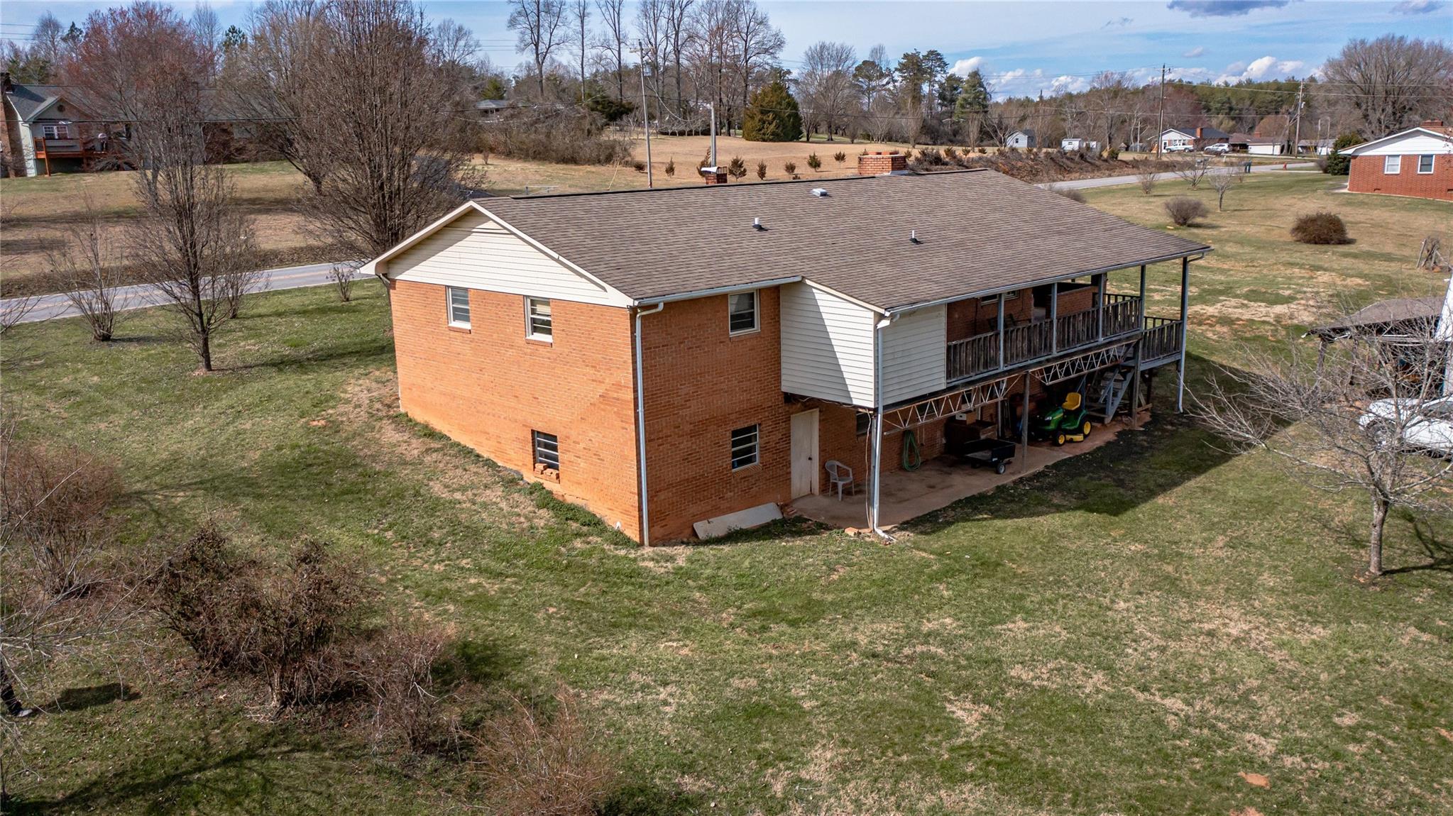 1437 Conley Road Morganton, NC 28655 - Photo 2 of 44 a view of a house with a yard and roof