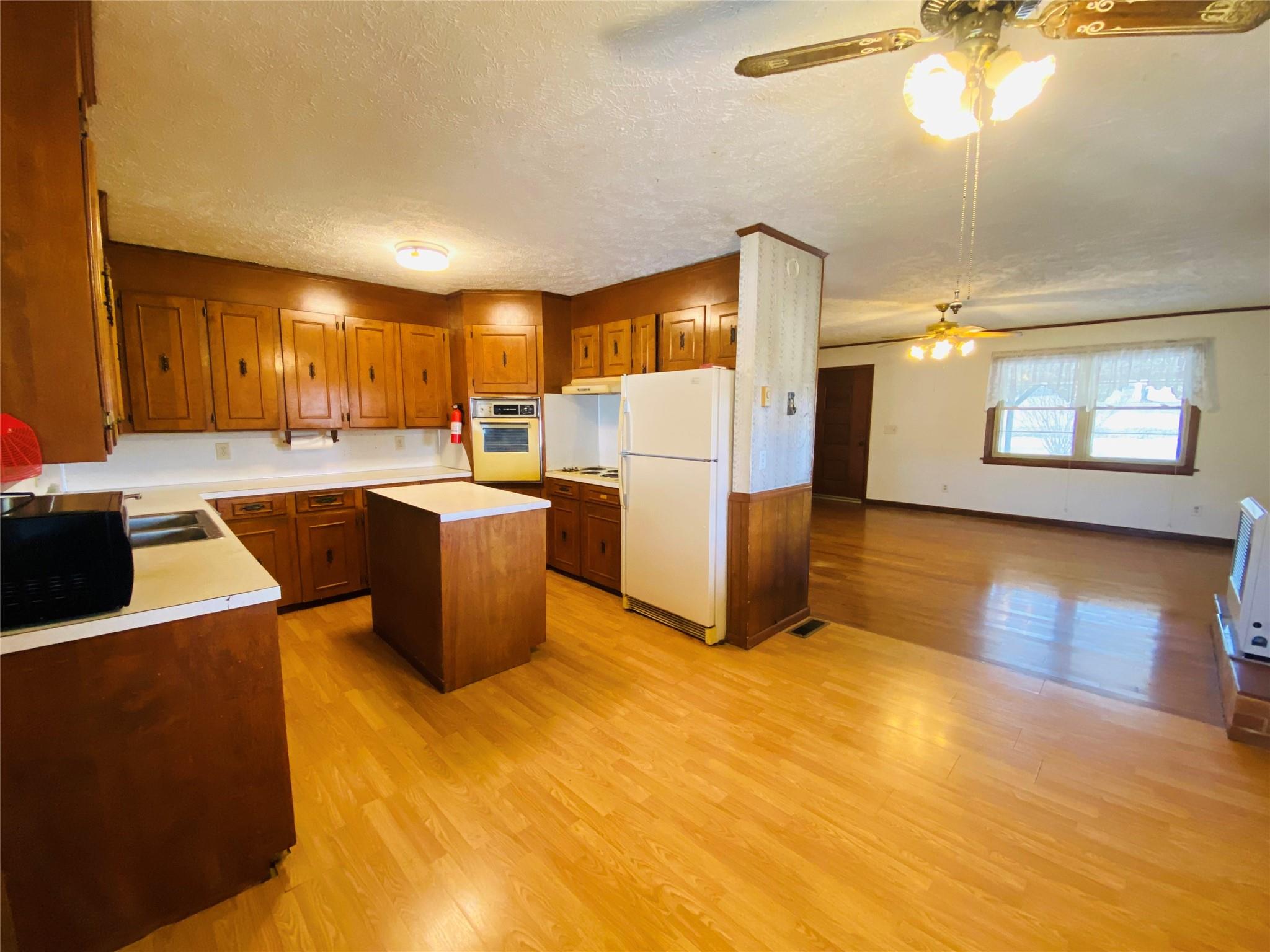 1437 Conley Road Morganton, NC 28655 - Photo 24 of 44 a kitchen with stainless steel appliances a stove a refrigerator a sink dishwasher with a dining table and chairs
