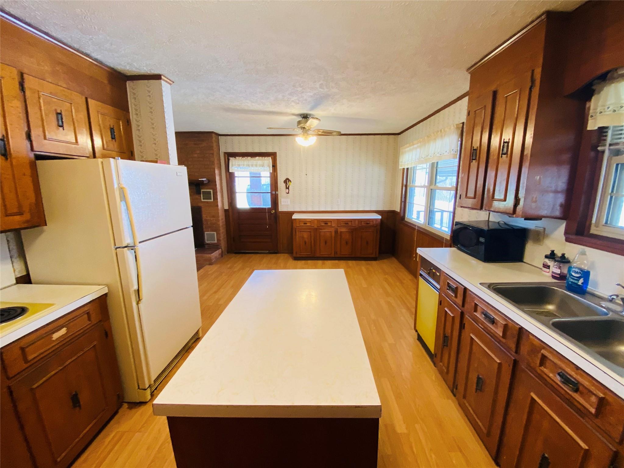 1437 Conley Road Morganton, NC 28655 - Photo 25 of 44 a kitchen with a refrigerator a sink and dishwasher
