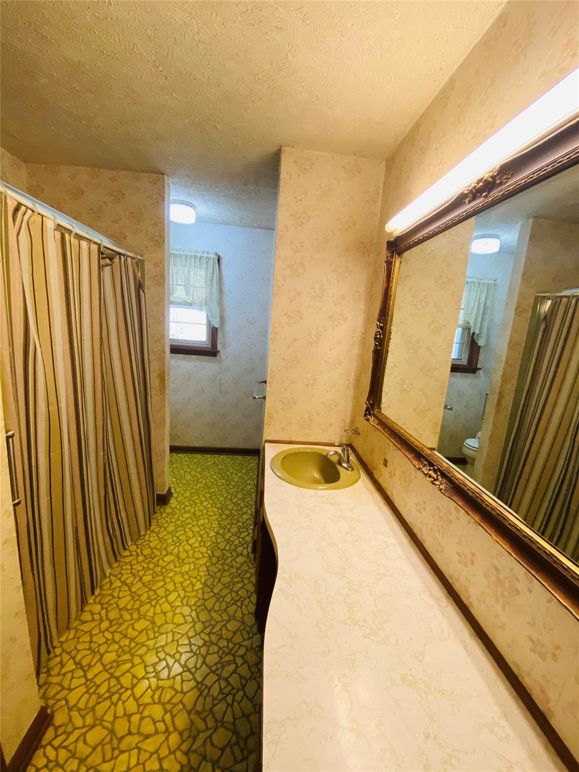 1437 Conley Road Morganton, NC 28655 - Photo 28 of 44 a bathroom with a tub and shower