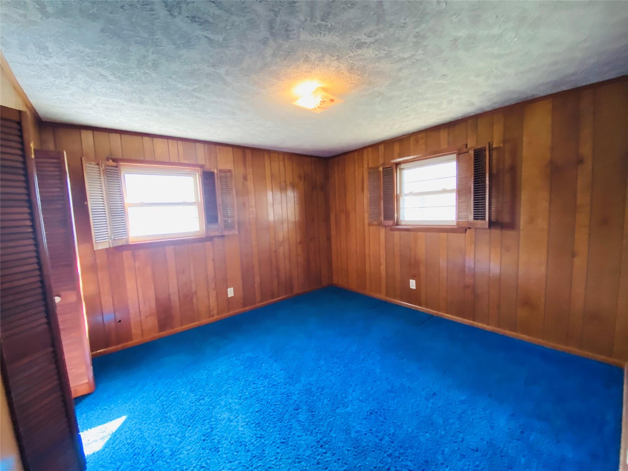 1437 Conley Road Morganton, NC 28655 - Photo 36 of 44 an empty room with wooden floor and windows