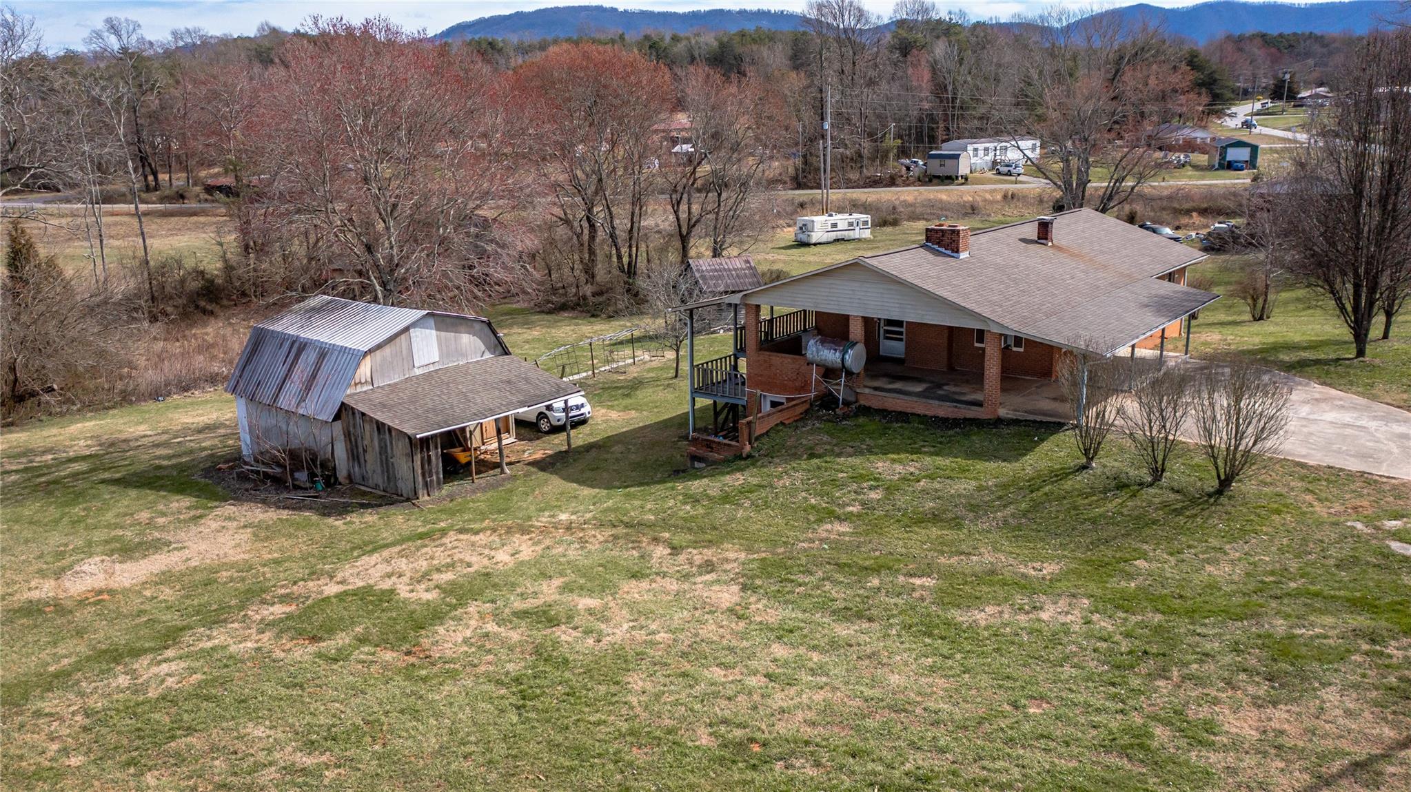 1437 Conley Road Morganton, NC 28655 - Photo 7 of 44 a view of a house with a yard and sitting area