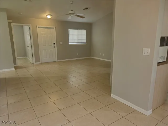a view of an empty room with closet area