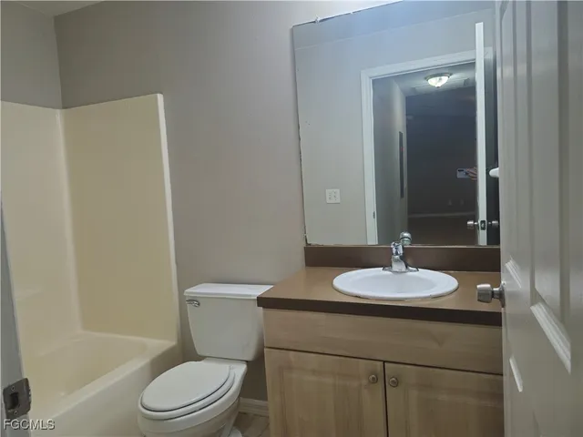 an empty room with closet area